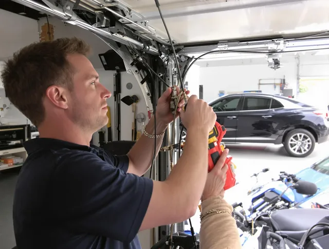 Wildomar Garage Door Repair safety certified technician performing cable replacement in Wildomar